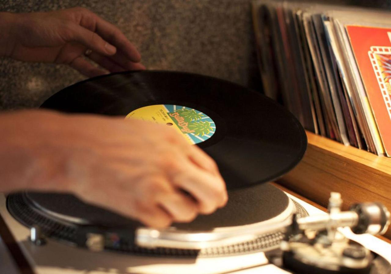 Potato Head Suites & Studios Seminyak Kültér fotó A record being placed on a turntable